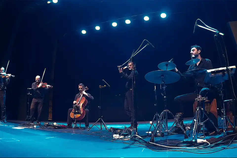 Ondanueve performing live in a theatre as a quintet with percussion